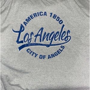 Brand new woman’s Tee size small but fits large